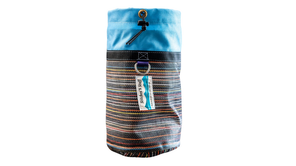 A blue mesh and cordura bowline bag with rope cinch closure and d-ring. 