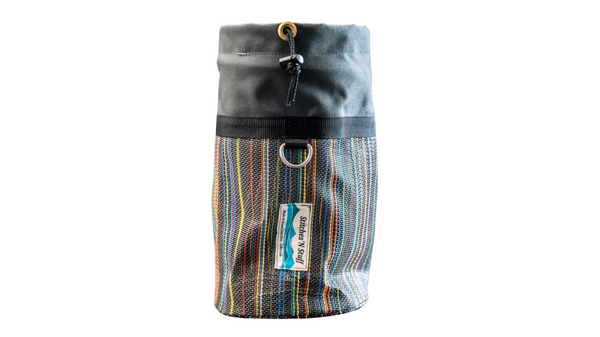 A grey mesh and cordura bowline bag with rope cinch closure and d-ring. 