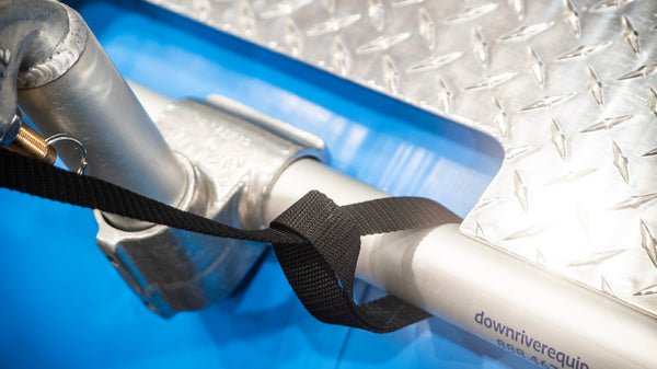 Close up showing the frame attachment for the buckle side of an oar leash on a Down River Equipment raft frame