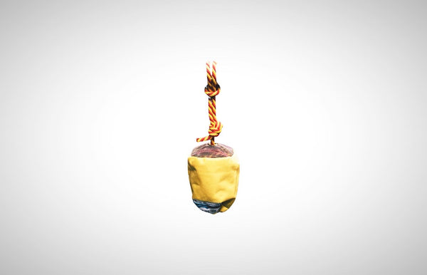 A yellow cordura flip line bag with floating polypro rope. 